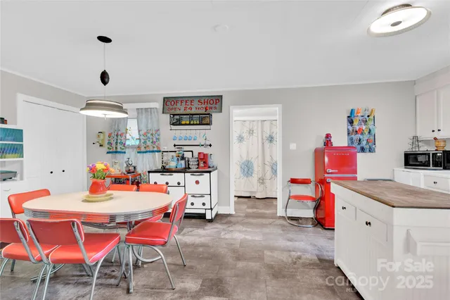 a dining room with furniture and wooden floor