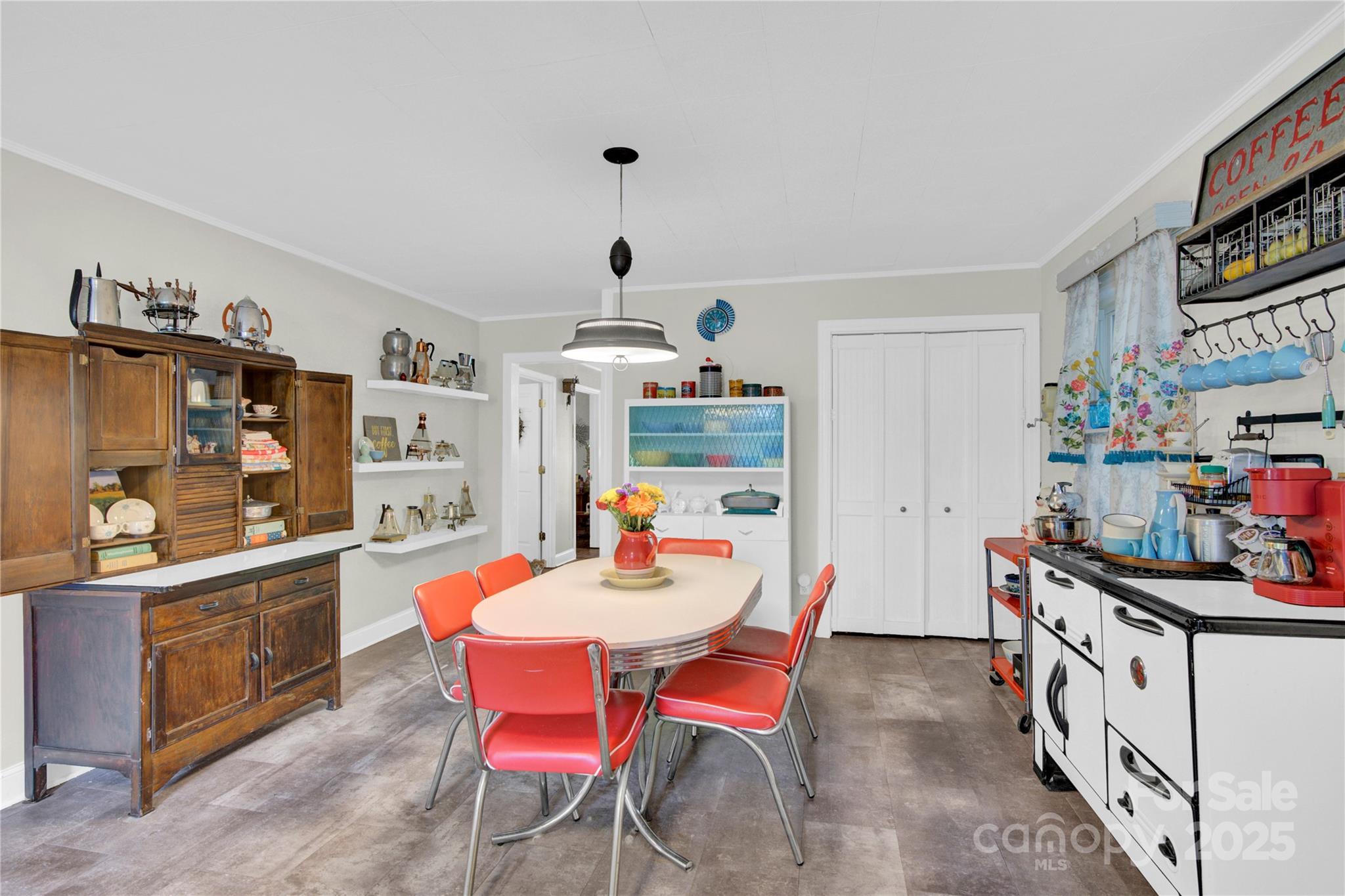 4959 King Wilkinson Road Denver, NC 28037 - Photo 12 of 41 a dining room with furniture and a kitchen view