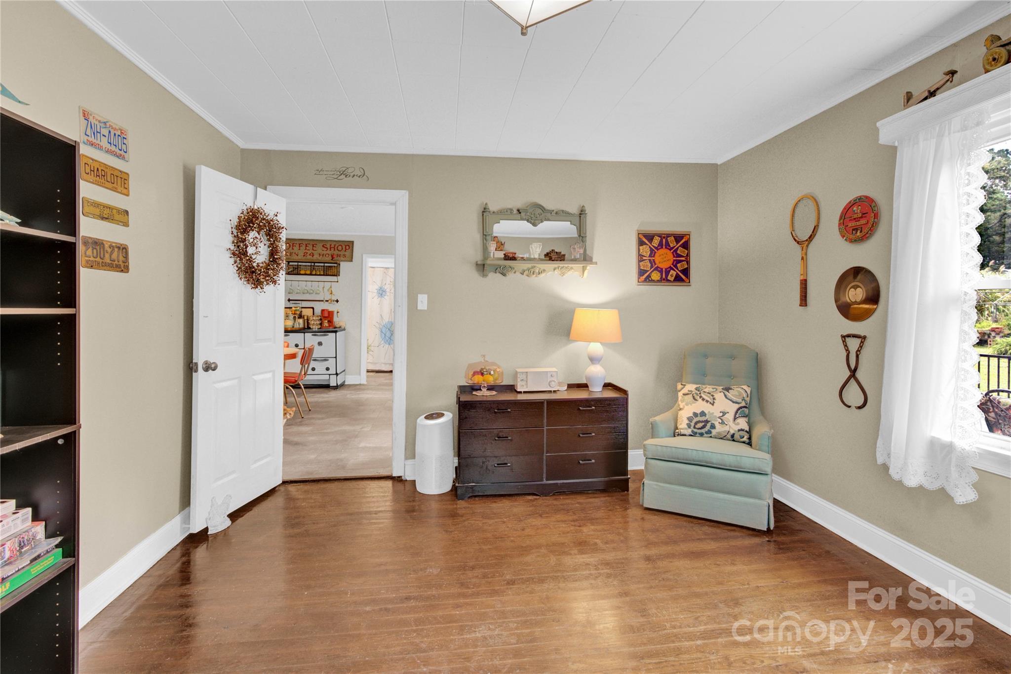 4959 King Wilkinson Road Denver, NC 28037 - Photo 19 of 41 a living room with furniture and a refrigerator