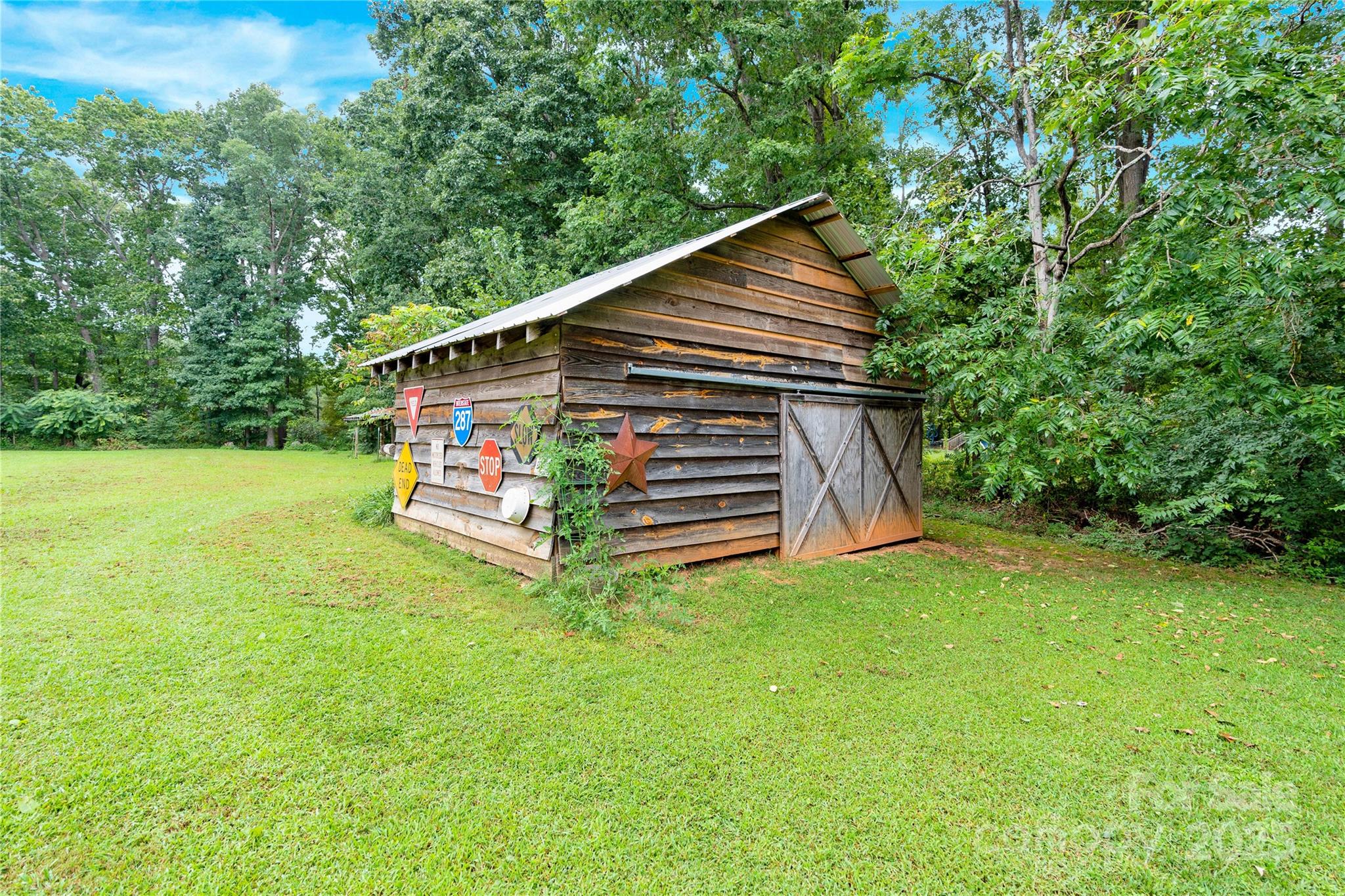 4959 King Wilkinson Road Denver, NC 28037 - Photo 25 of 41 a view of a house with backyard