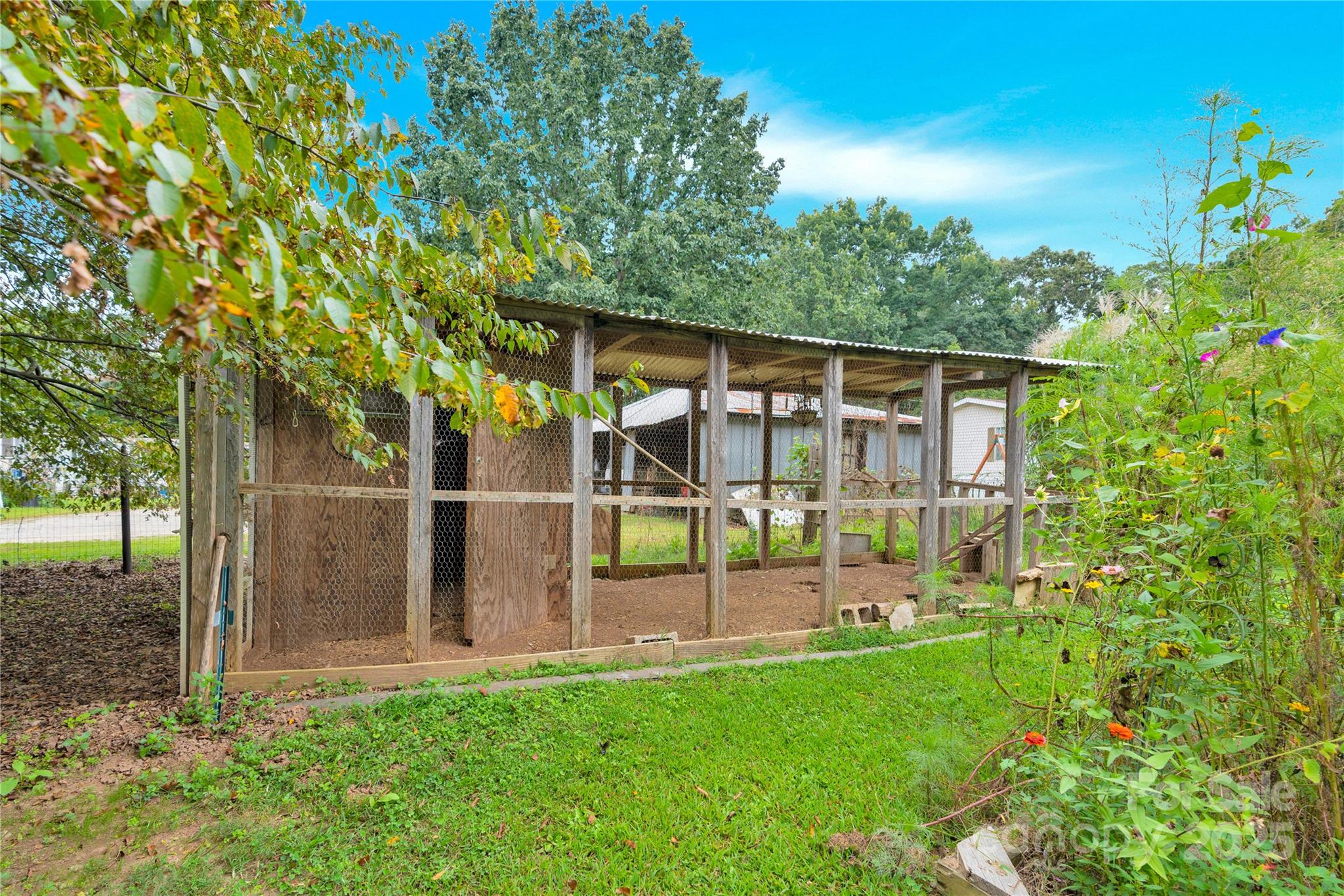 4959 King Wilkinson Road Denver, NC 28037 - Photo 27 of 41 a view of a house with backyard and sitting area