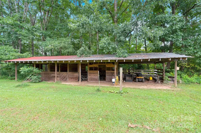 a view of a house with a yard porch and sitting area