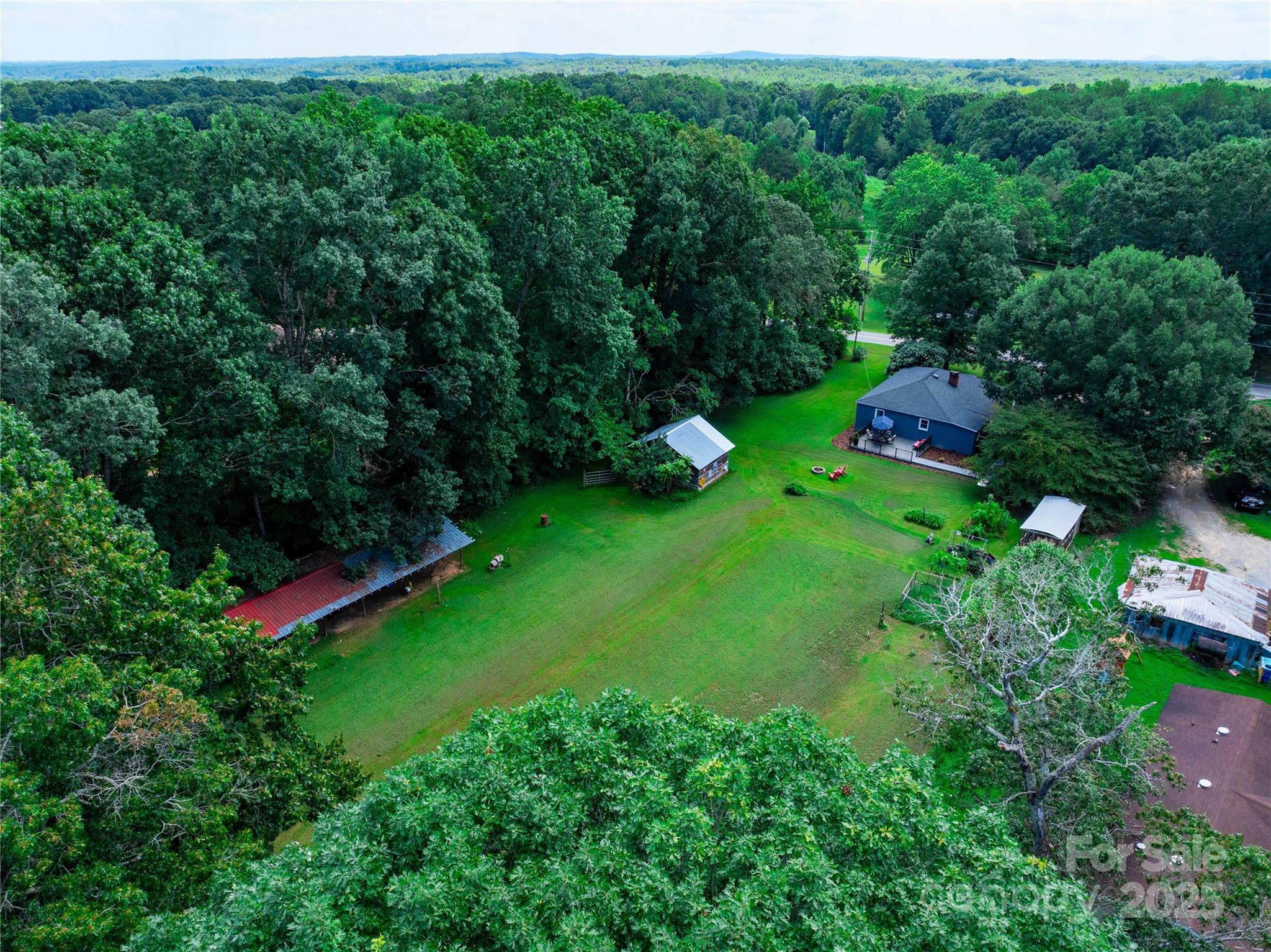 4959 King Wilkinson Road Denver, NC 28037 - Photo 32 of 41 an aerial view of residential house with outdoor space and trees all around
