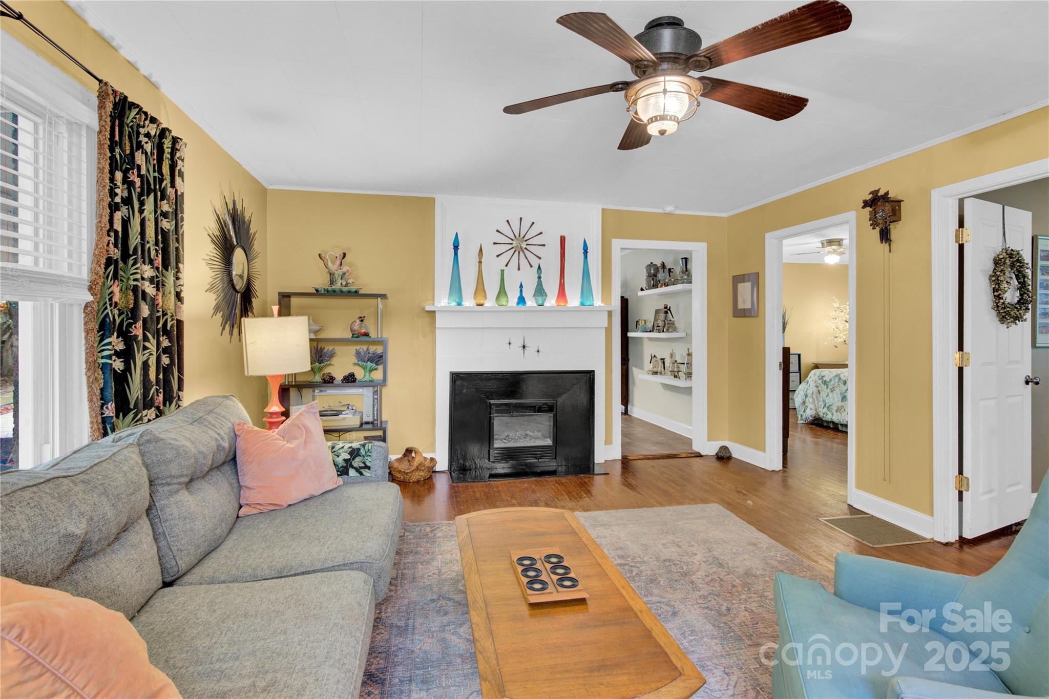 4959 King Wilkinson Road Denver, NC 28037 - Photo 4 of 41 a living room with furniture and a fireplace
