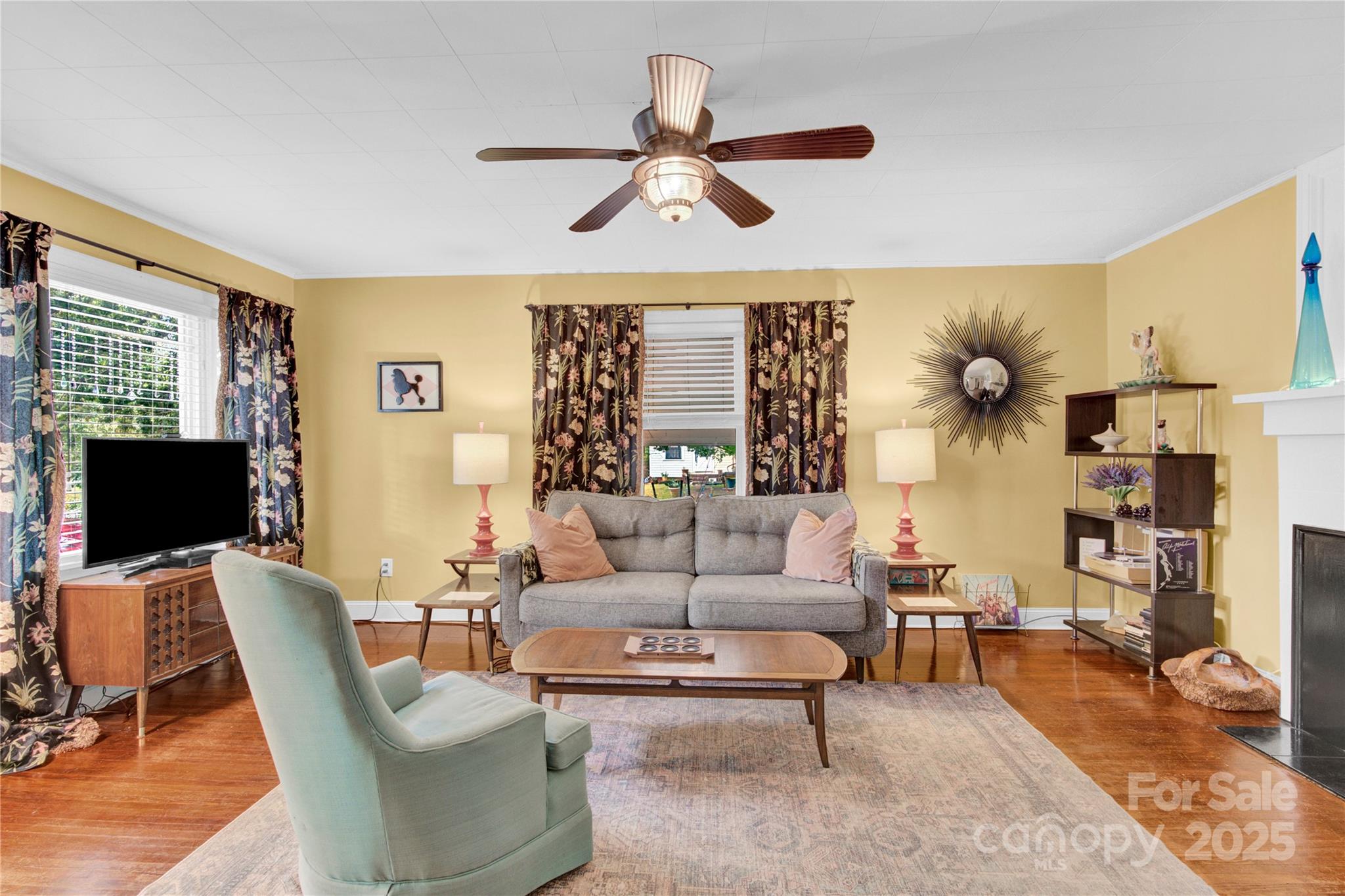 4959 King Wilkinson Road Denver, NC 28037 - Photo 5 of 41 a living room with furniture a rug and a flat screen tv