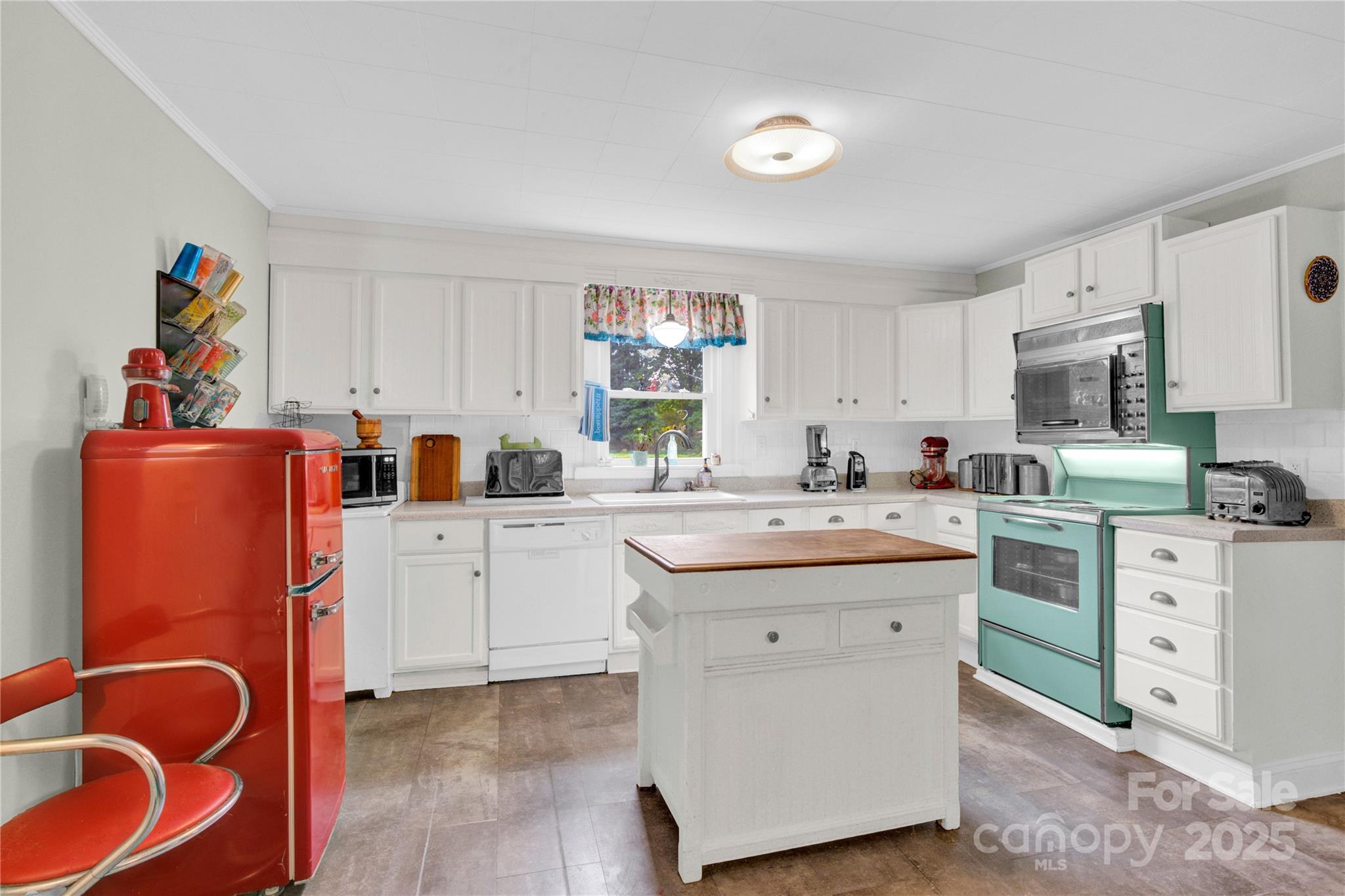 4959 King Wilkinson Road Denver, NC 28037 - Photo 7 of 41 a kitchen with cabinets a sink and appliances