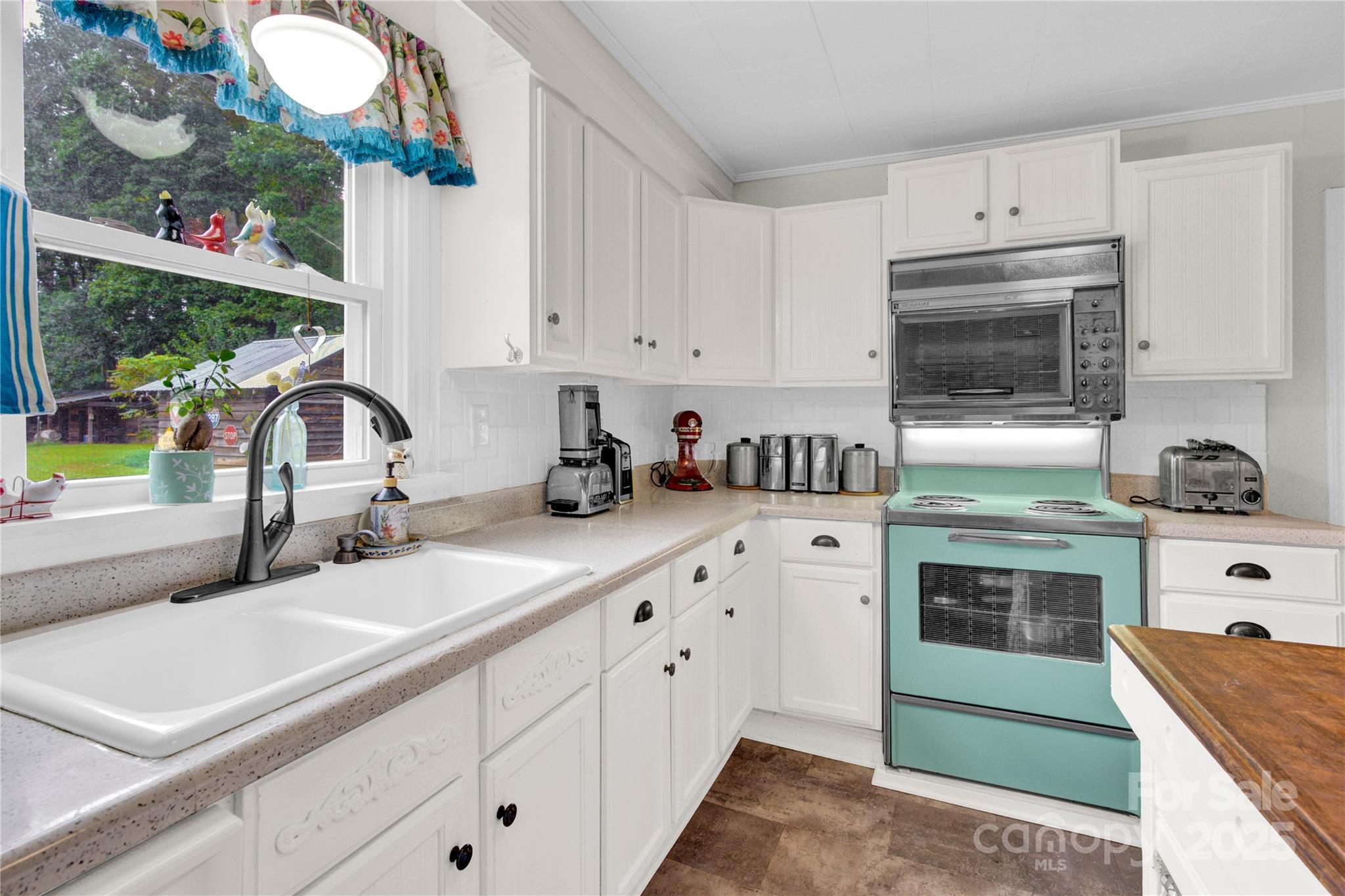 4959 King Wilkinson Road Denver, NC 28037 - Photo 9 of 41 a kitchen with granite countertop a sink stainless steel appliances and cabinets