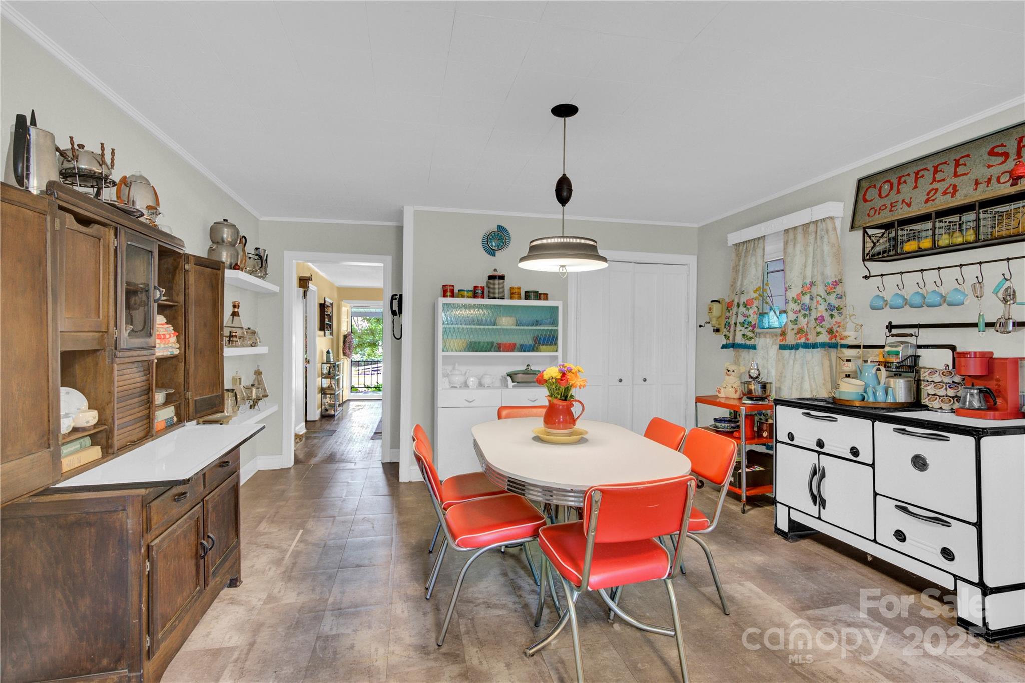 4959 King Wilkinson Road Denver, NC 28037 - Photo 10 of 41 a dining room with stainless steel appliances kitchen island granite countertop a table chairs stove and a refrigerator