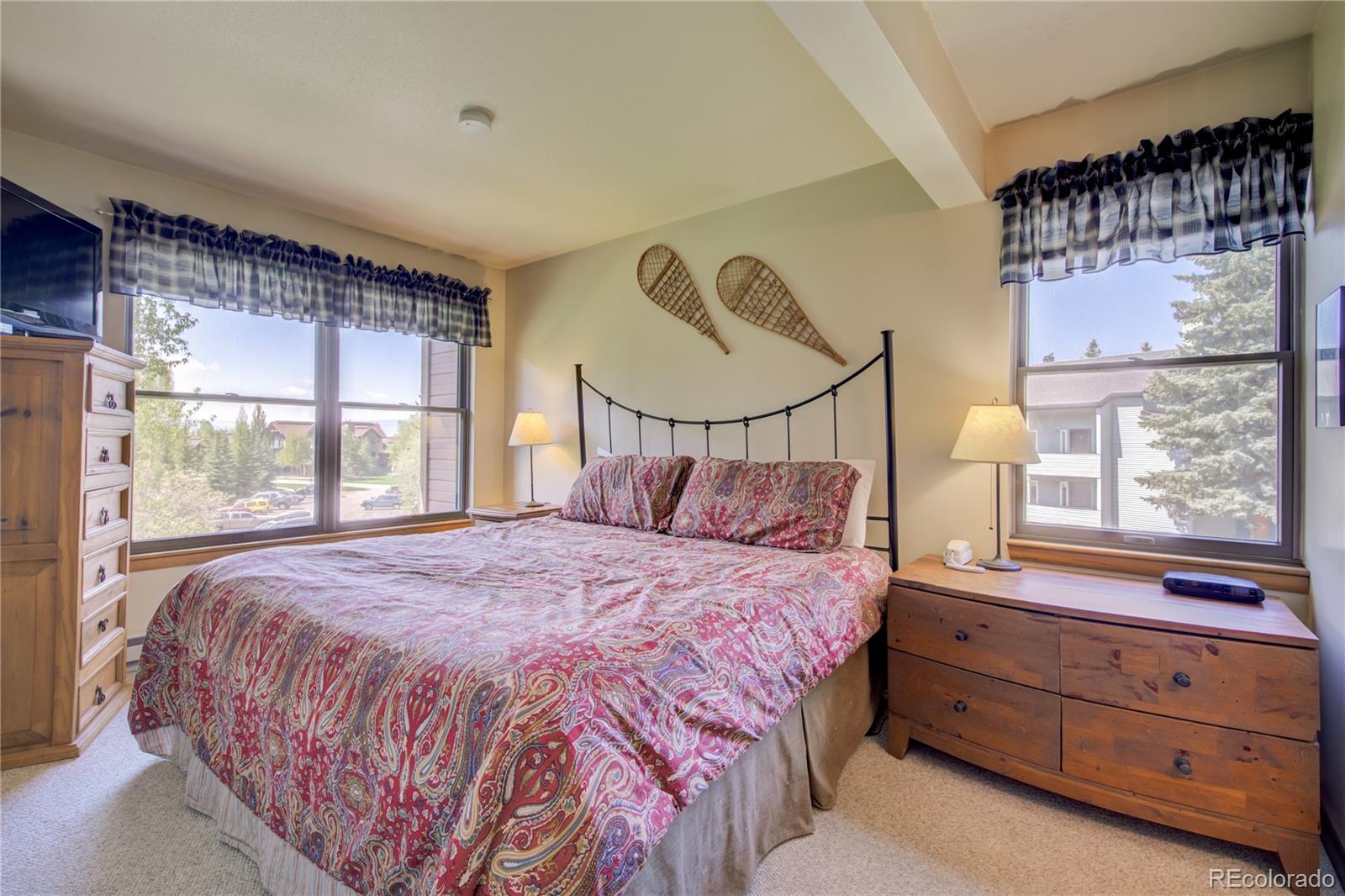 2015 Walton Creek Road, Unit 114 Steamboat Springs, CO 80487 - Photo 14 of 29 a bedroom with a bed and window