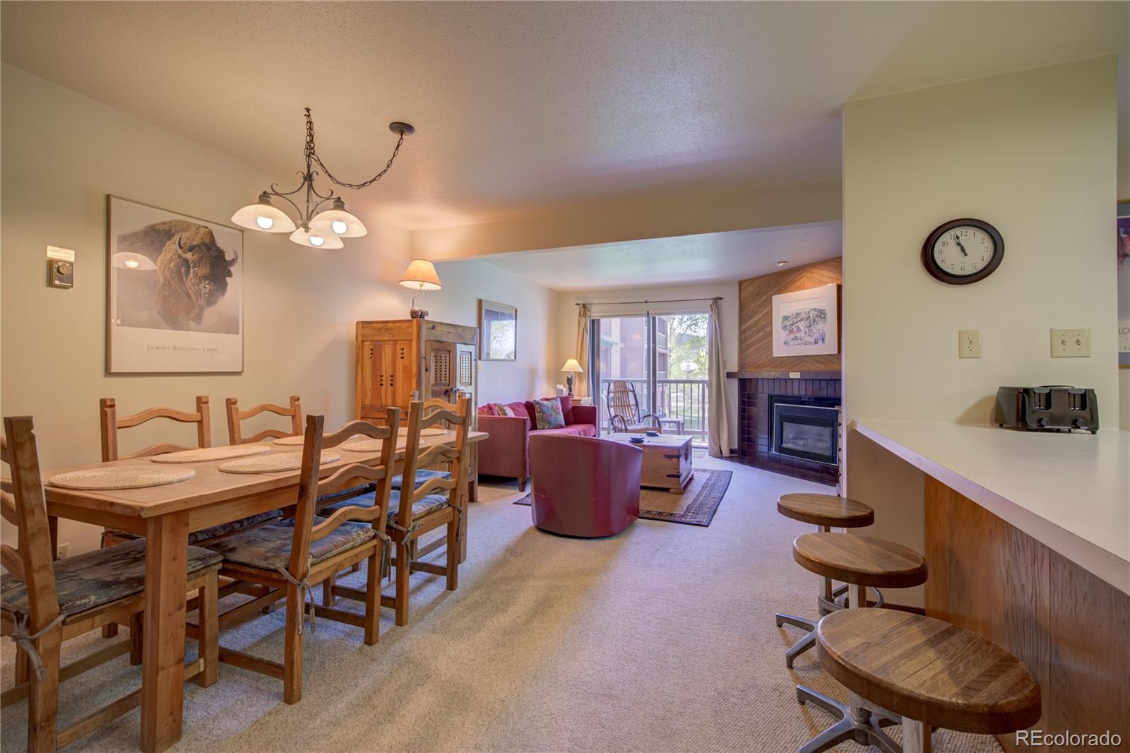 2015 Walton Creek Road, Unit 114 Steamboat Springs, CO 80487 - Photo 2 of 29 a view of a livingroom with furniture and a large window