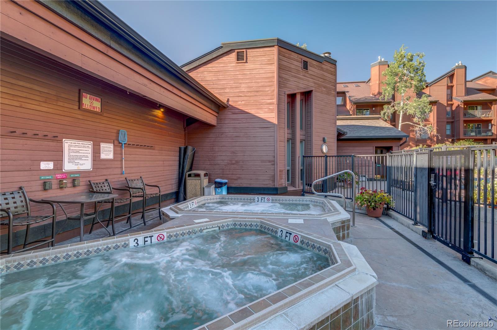 2015 Walton Creek Road, Unit 114 Steamboat Springs, CO 80487 - Photo 25 of 29 a view of a dinning tables and chairs in patio