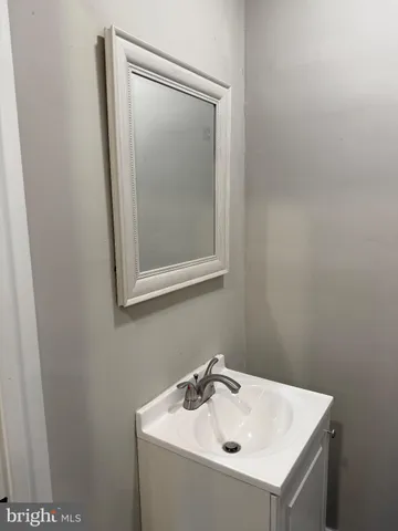 a bathroom with a sink and vanity
