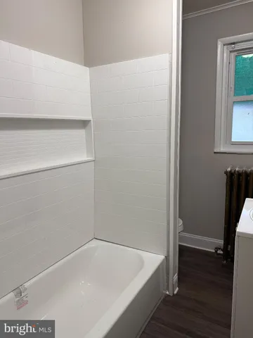 a utility room with a sink washer and dryer