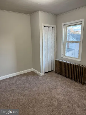 a view of a room with wooden walls