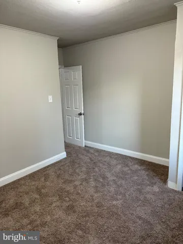 a view of a room with wooden walls