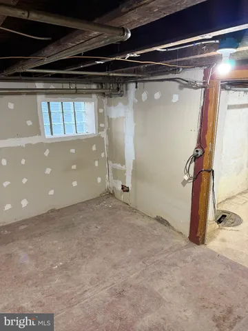 a view of empty room with wooden floor and cabinet