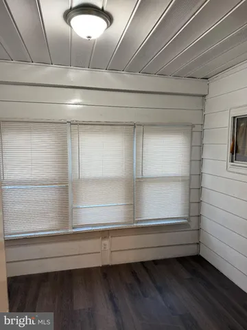 a view of a house with brick walls