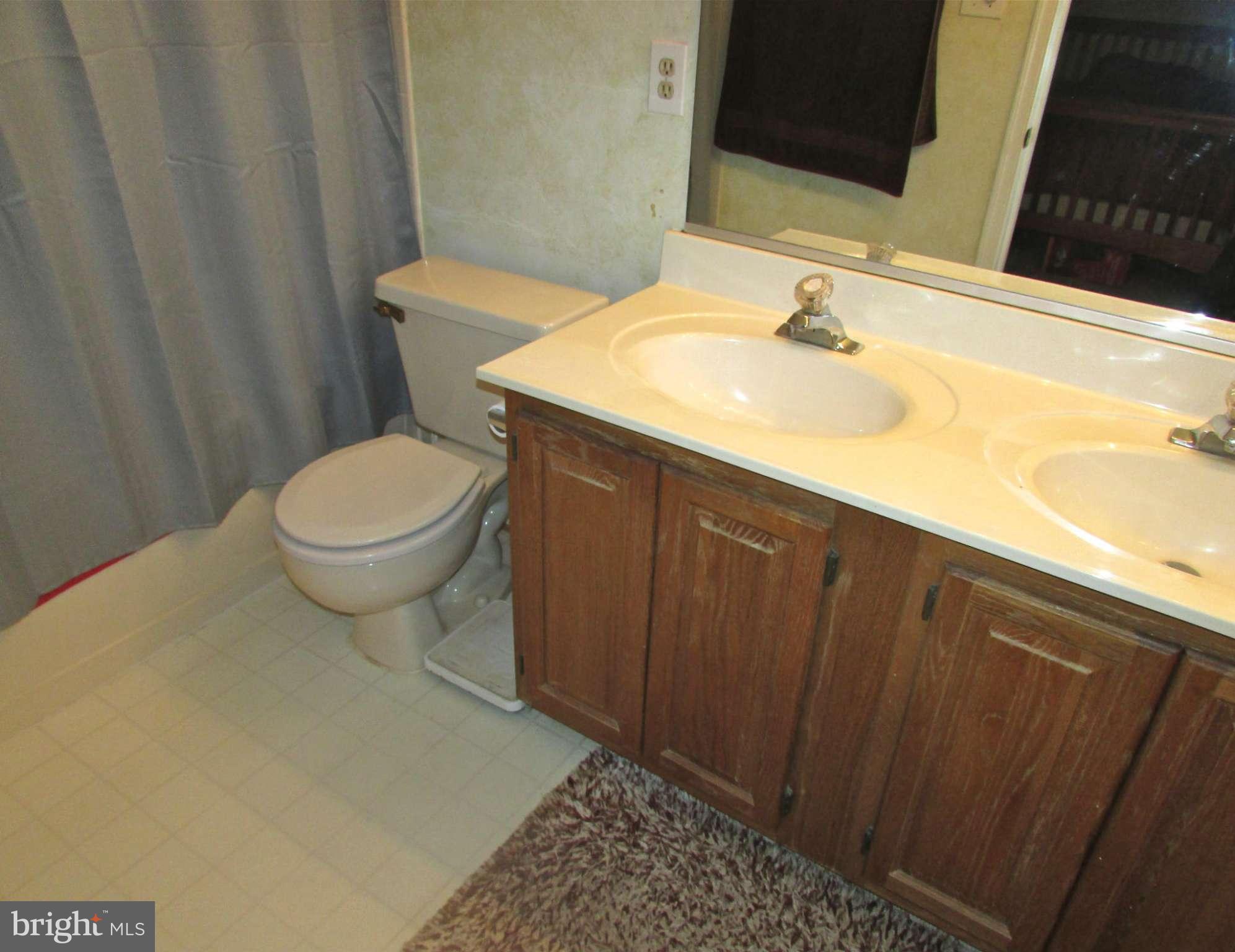 6808 Compton Valley Place Centreville, VA 20121 - Photo 9 of 16 a bathroom with a sink and a toilet