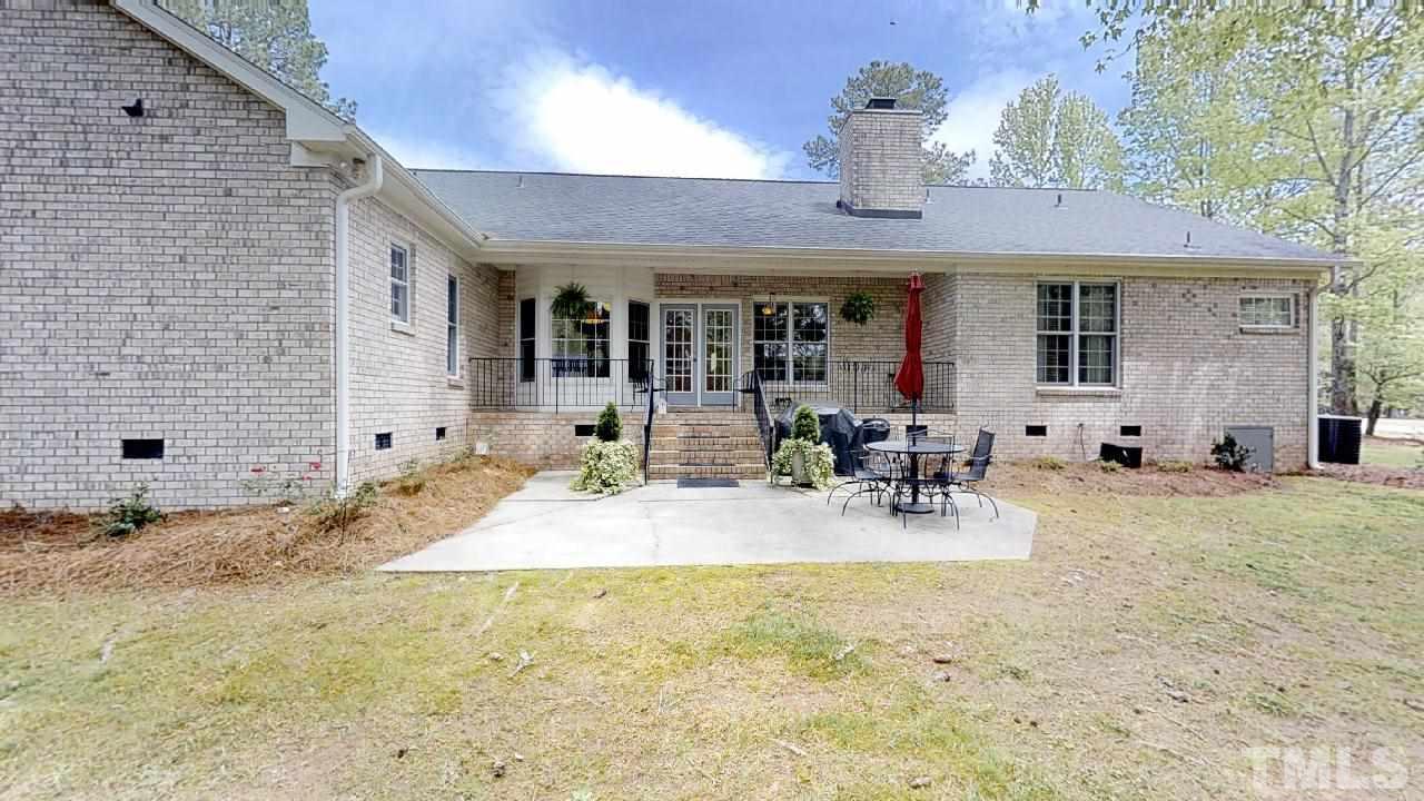 4012 Stone Summit Lane Raleigh, NC 27603 - Photo 3 of 20 Covered Porch & Shaded Patio