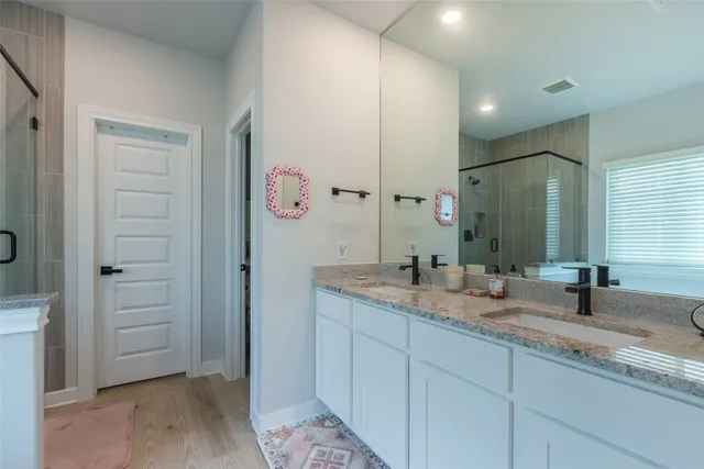 a bedroom with a bed and dresser