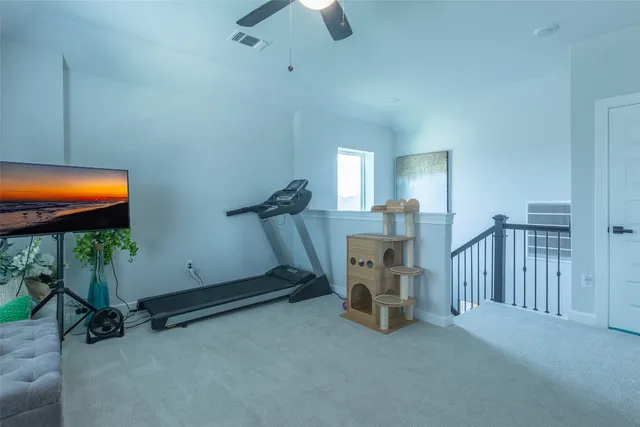 a room with furniture and a flat screen tv