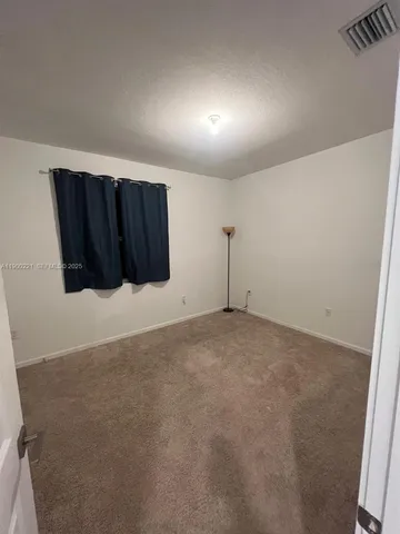 a white toilet sitting next to a bath tub