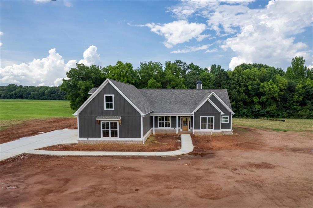 5340 Bethany Road Buckhead, GA 30625 - Photo 1 of 1 a view of house with outdoor space and trees around