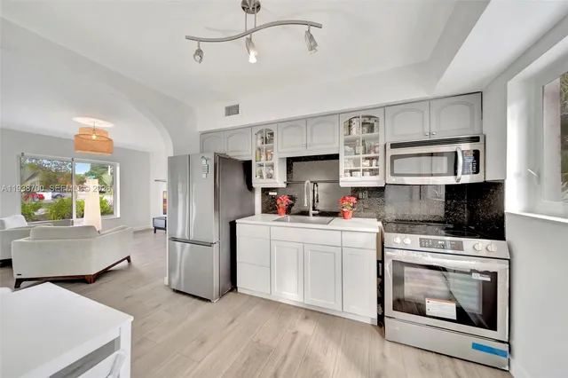 a view of a livingroom with furniture and wooden floor