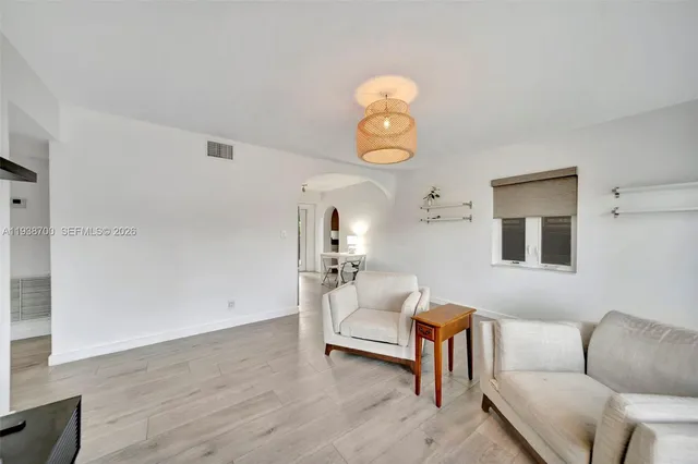 a kitchen that has a refrigerator and a stove