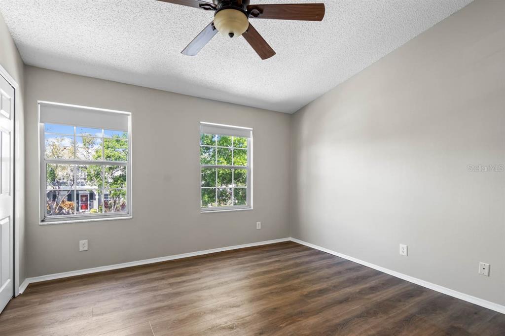 273 Countryside Key Boulevard Oldsmar, FL 34677 - Photo 15 of 32 a view of an empty room with wooden floor and a window