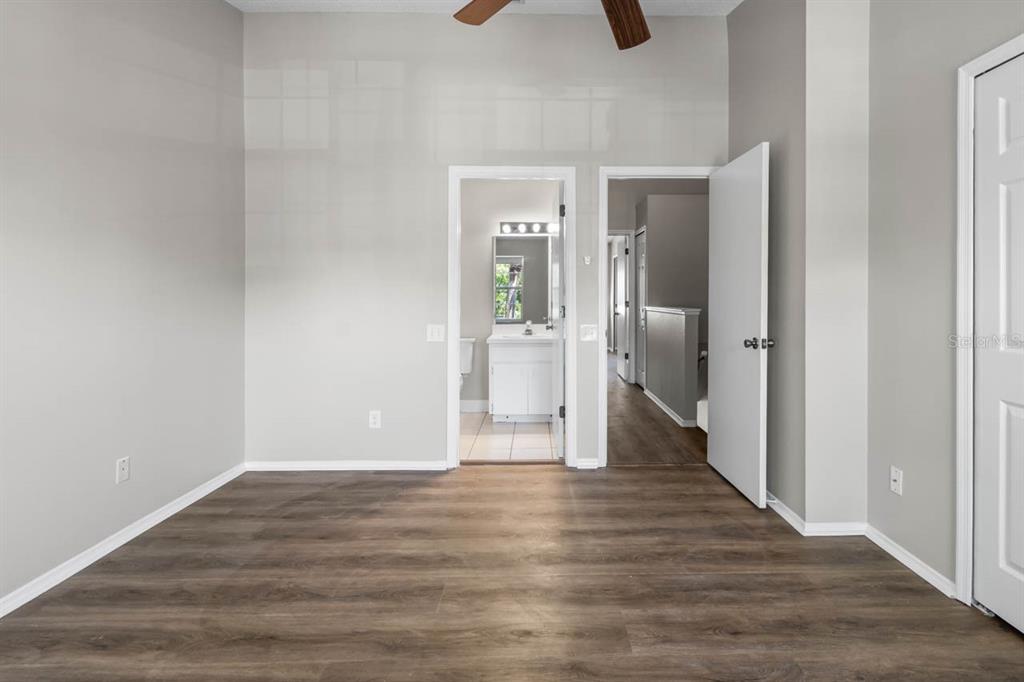 273 Countryside Key Boulevard Oldsmar, FL 34677 - Photo 16 of 32 a view of an empty room with wooden floor