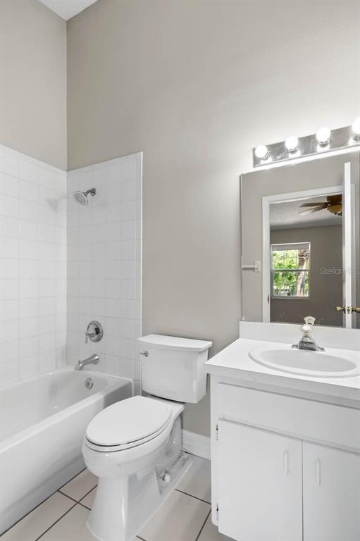 273 Countryside Key Boulevard Oldsmar, FL 34677 - Photo 17 of 32 a bathroom with a sink a toilet and shower