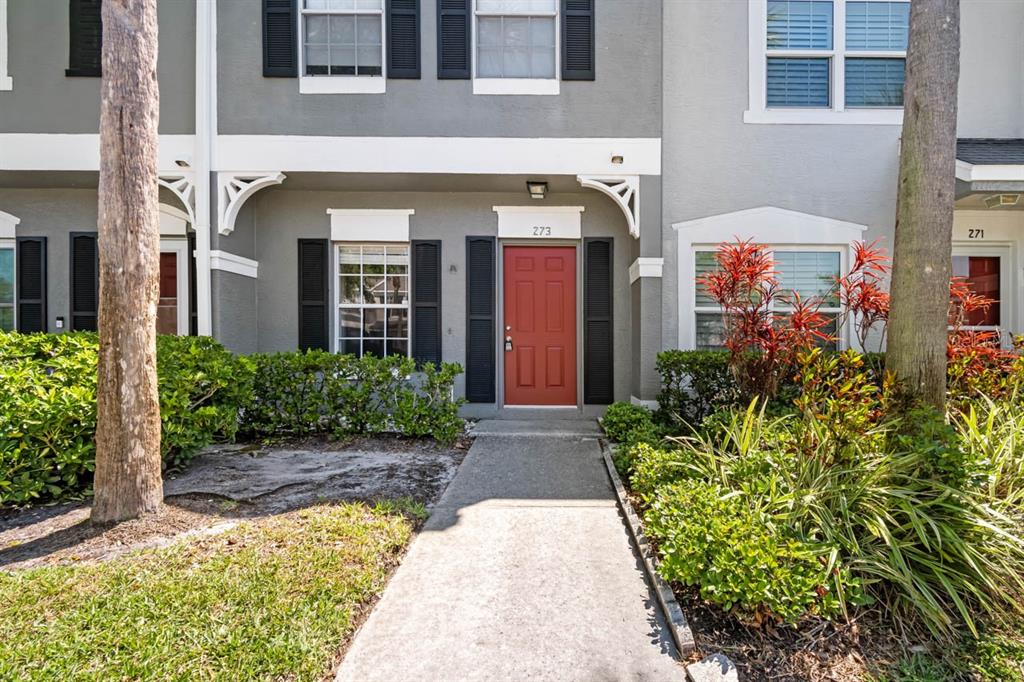 273 Countryside Key Boulevard Oldsmar, FL 34677 - Photo 26 of 32 a front view of a house with garden