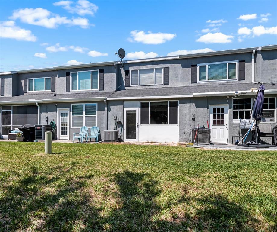 273 Countryside Key Boulevard Oldsmar, FL 34677 - Photo 28 of 32 a front view of a house with a yard