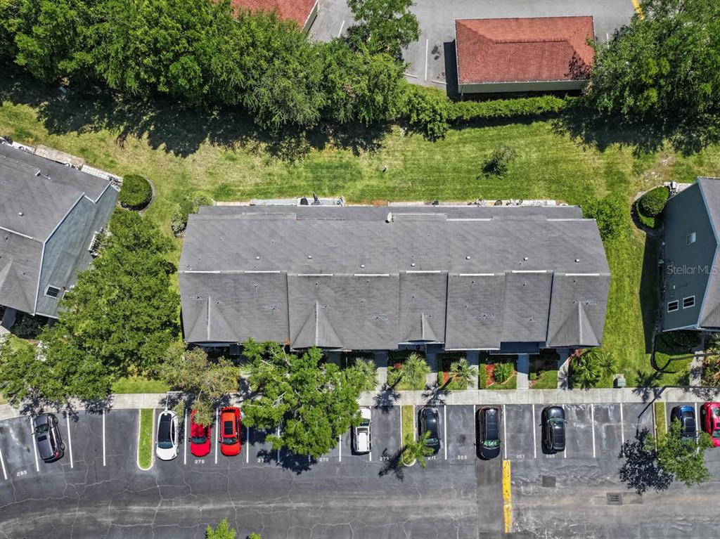 273 Countryside Key Boulevard Oldsmar, FL 34677 - Photo 30 of 32 a aerial view of a house with potted plants and a yard