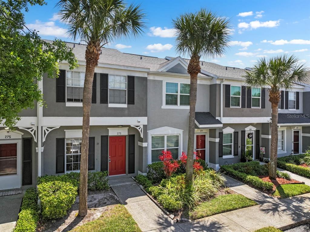 273 Countryside Key Boulevard Oldsmar, FL 34677 - Photo 5 of 32 a front view of a house with yard and green space