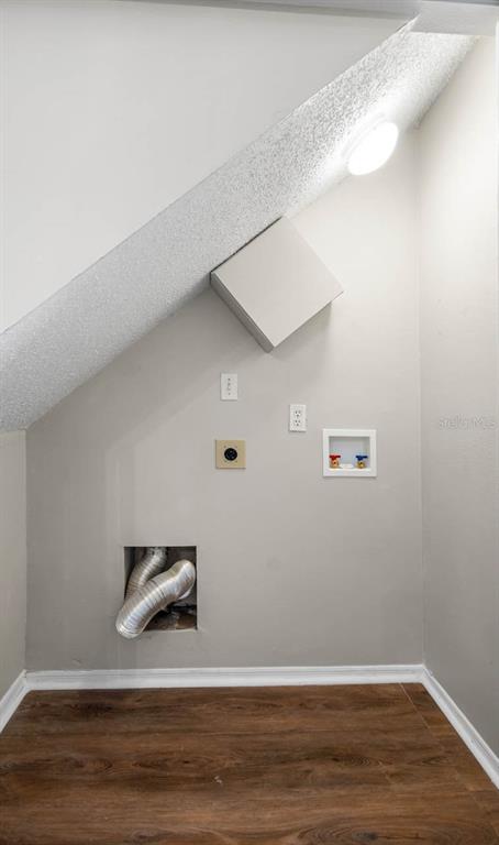 273 Countryside Key Boulevard Oldsmar, FL 34677 - Photo 10 of 32 a view of a hardwood floor and an entryway door