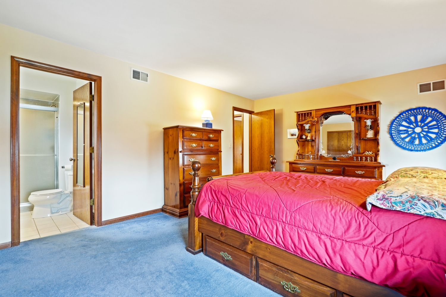 3463 Donovan Drive Crete, IL 60417 - Photo 12 of 23 a bedroom with a bed and dresser with bathroom