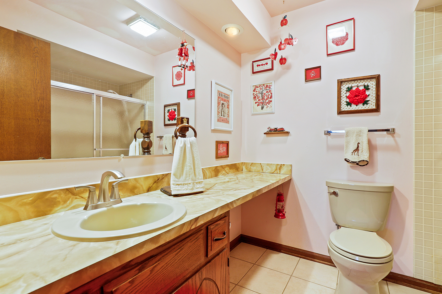 3463 Donovan Drive Crete, IL 60417 - Photo 16 of 23 a bathroom with a granite countertop sink a toilet and a mirror