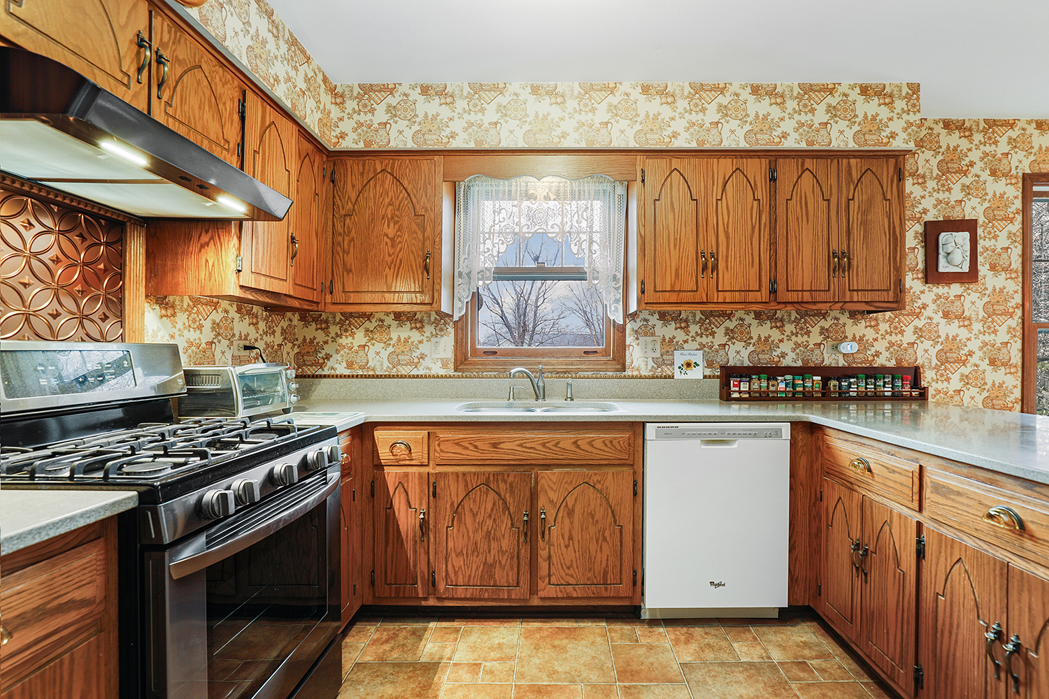 3463 Donovan Drive Crete, IL 60417 - Photo 6 of 23 a kitchen with stainless steel appliances granite countertop a stove a sink and a microwave