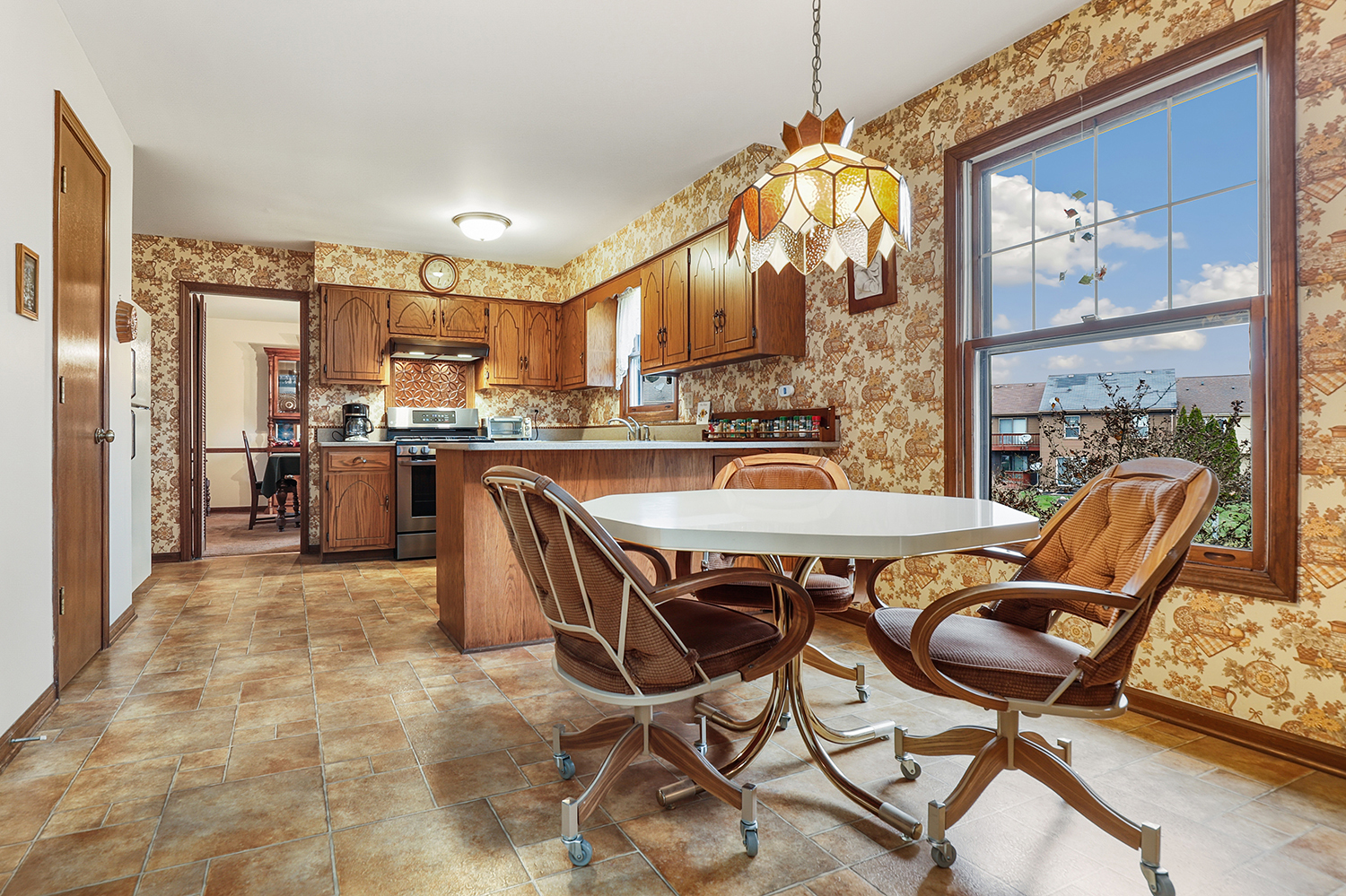 3463 Donovan Drive Crete, IL 60417 - Photo 7 of 23 a dining room filled chandelier and wooden furniture