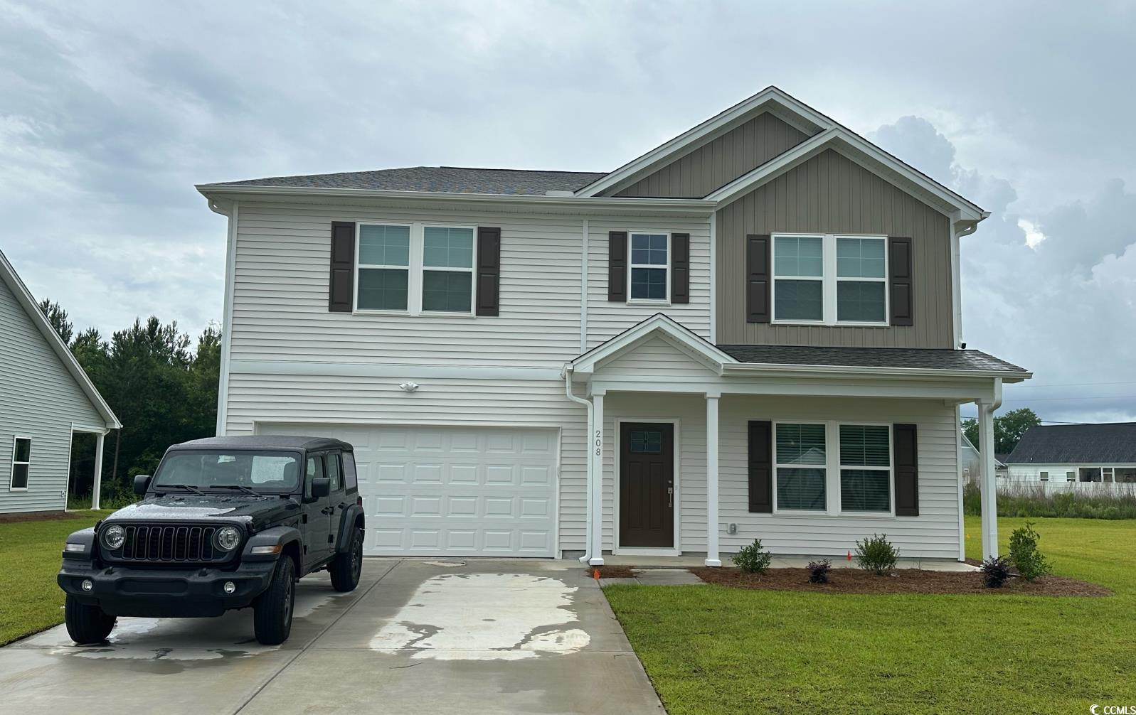 208 Sundrop Way Conway, SC 29526 - Photo 1 of 12 View of front of home featuring an attached garage