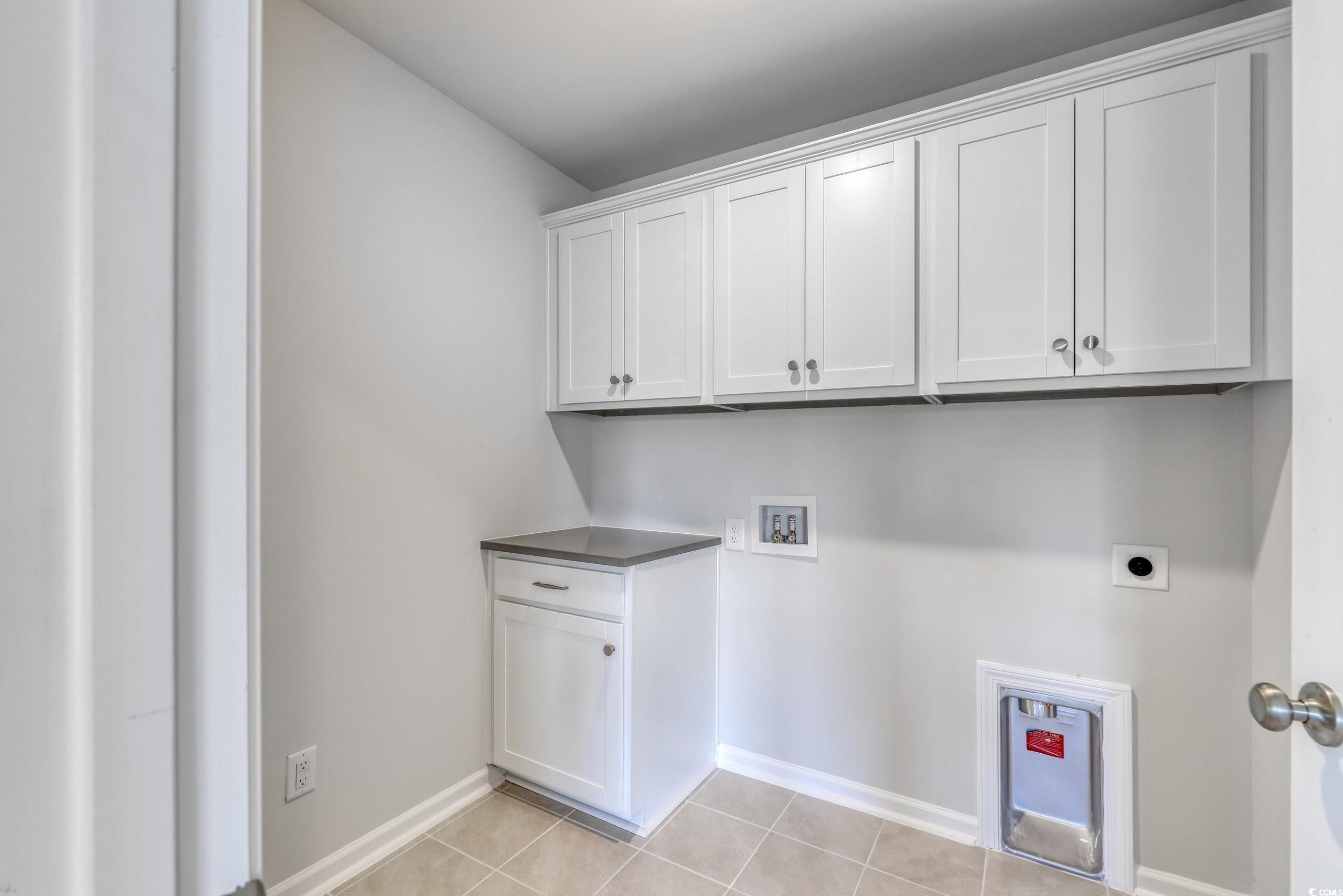 208 Sundrop Way Conway, SC 29526 - Photo 6 of 12 Washroom with light tile patterned floors, baseboa