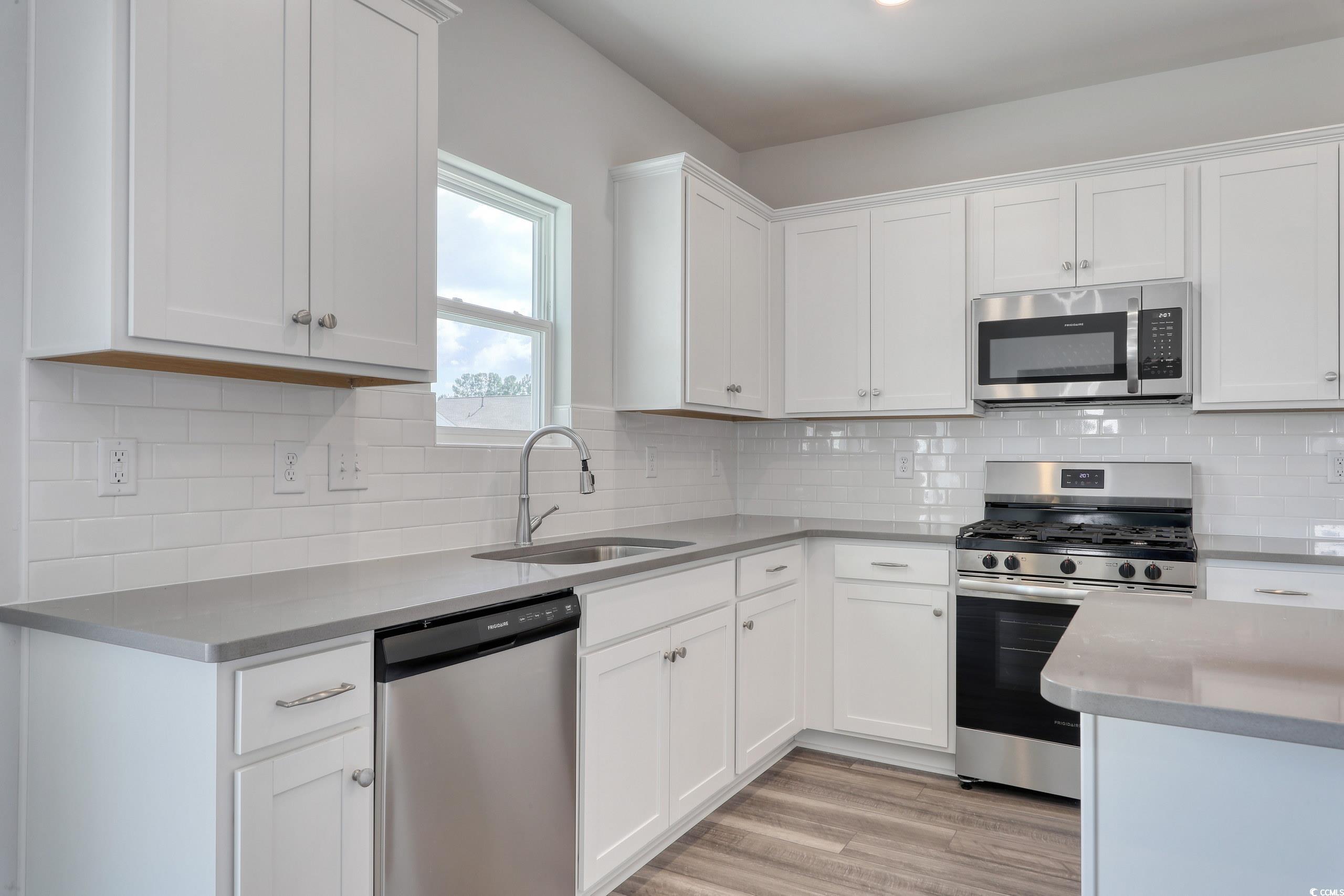 208 Sundrop Way Conway, SC 29526 - Photo 8 of 12 Kitchen with a sink, stainless steel appliances, l