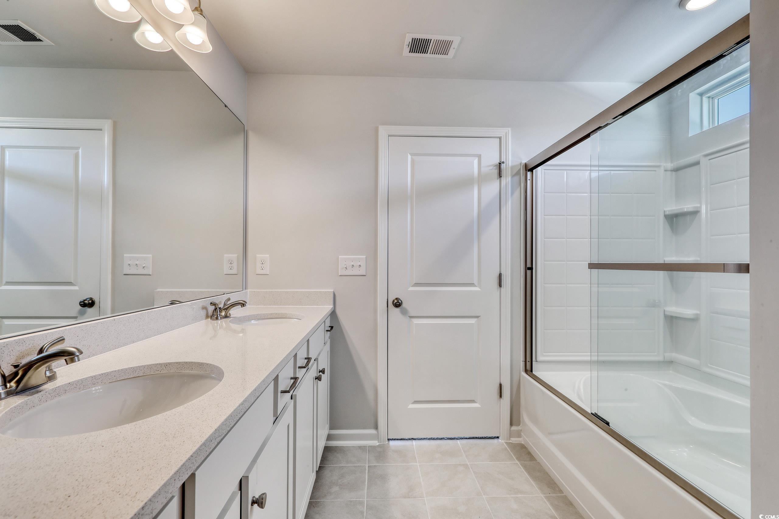 208 Sundrop Way Conway, SC 29526 - Photo 10 of 12 Bathroom featuring a sink, visible vents, and tile