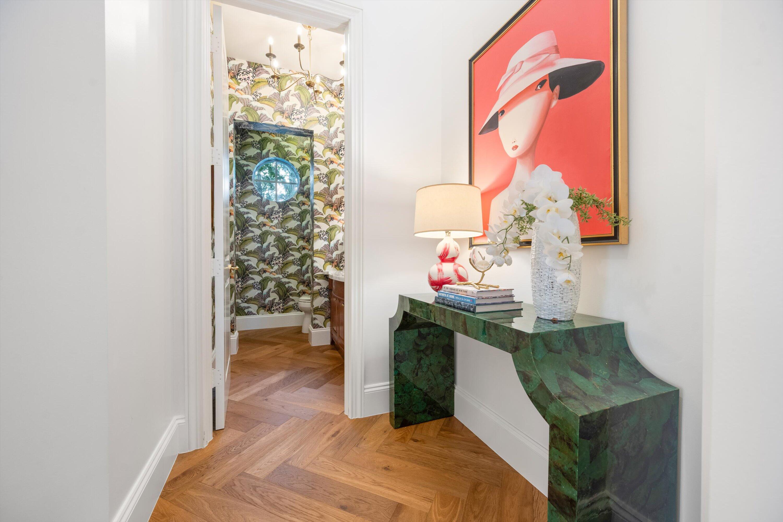 115 Echo Lane Jupiter, FL 33458 - Photo 23 of 35 a hallway with table and a potted plant