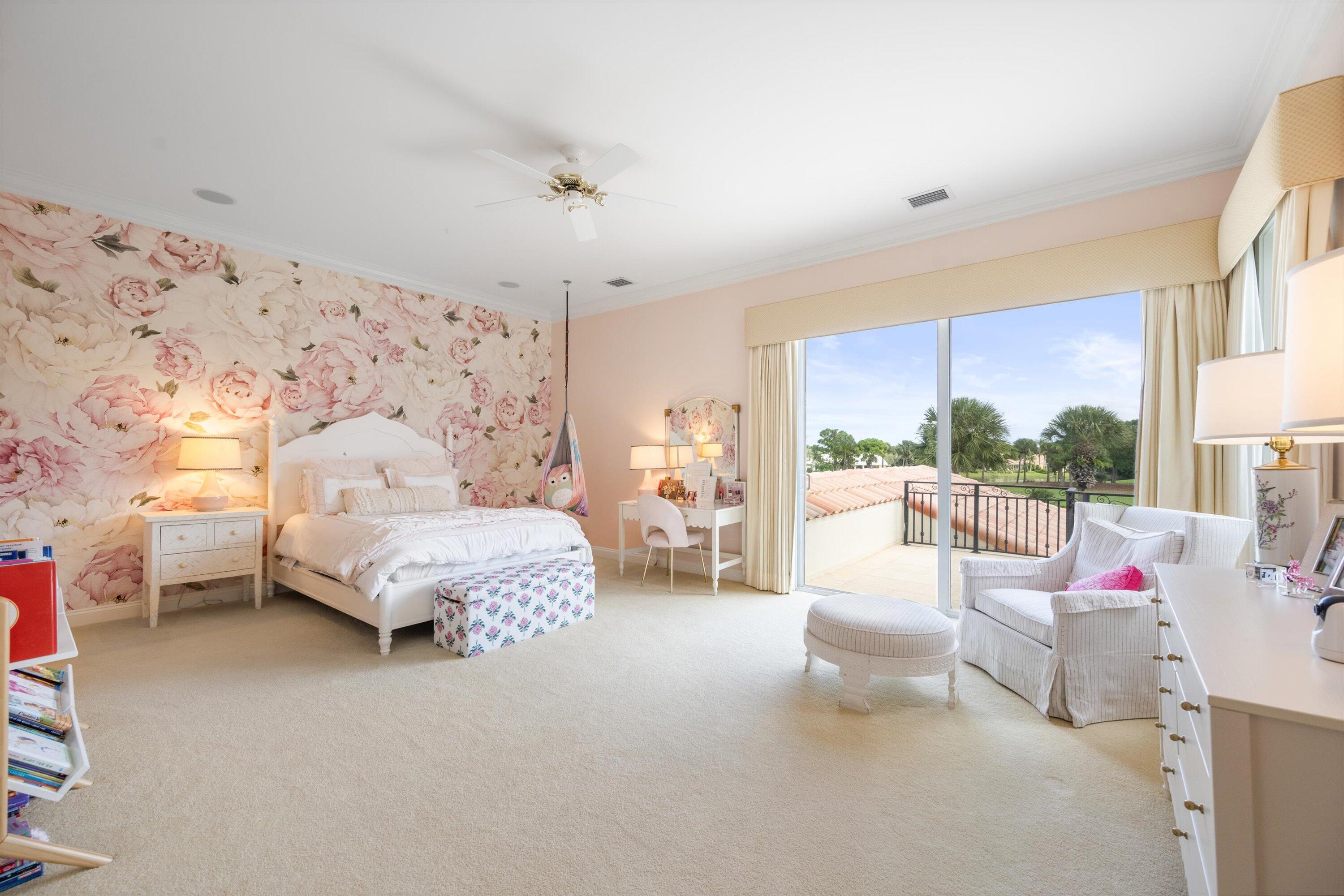 115 Echo Lane Jupiter, FL 33458 - Photo 28 of 35 a spacious bedroom with a bed couch and a window