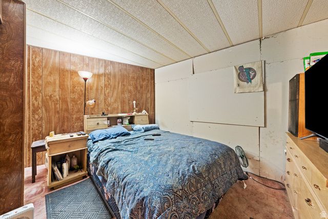 49 600 North Hurricane, UT 84737 - Photo 9 of 33 Bedroom featuring wooden walls and vaulted ceiling