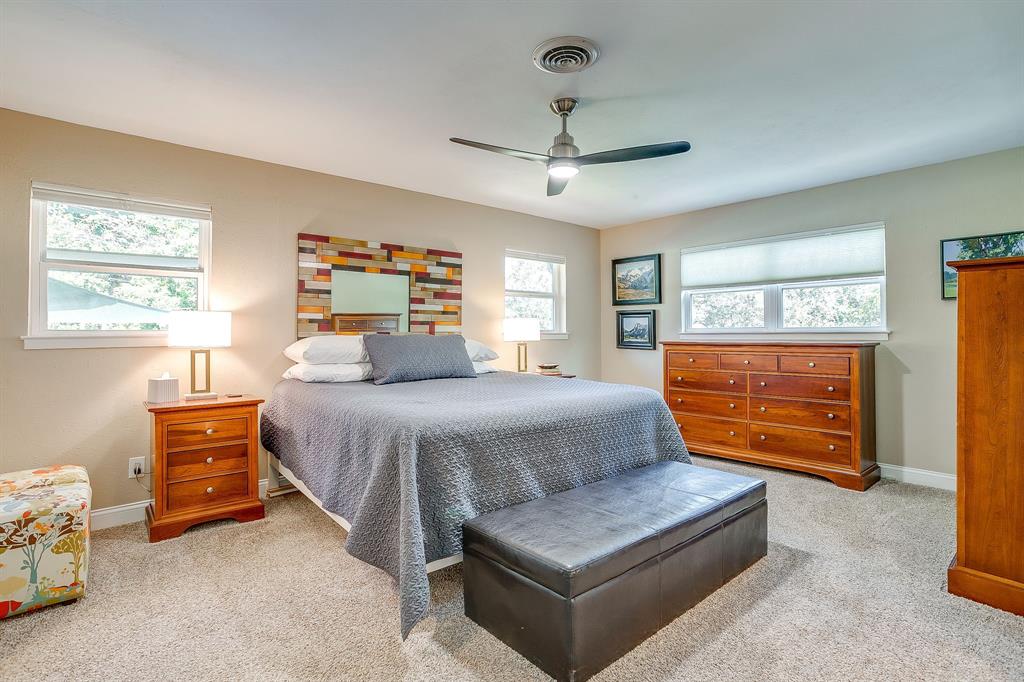 1816 Granada Road Fort Worth, TX 76116 - Photo 19 of 40 a bedroom with a bed and a dresser