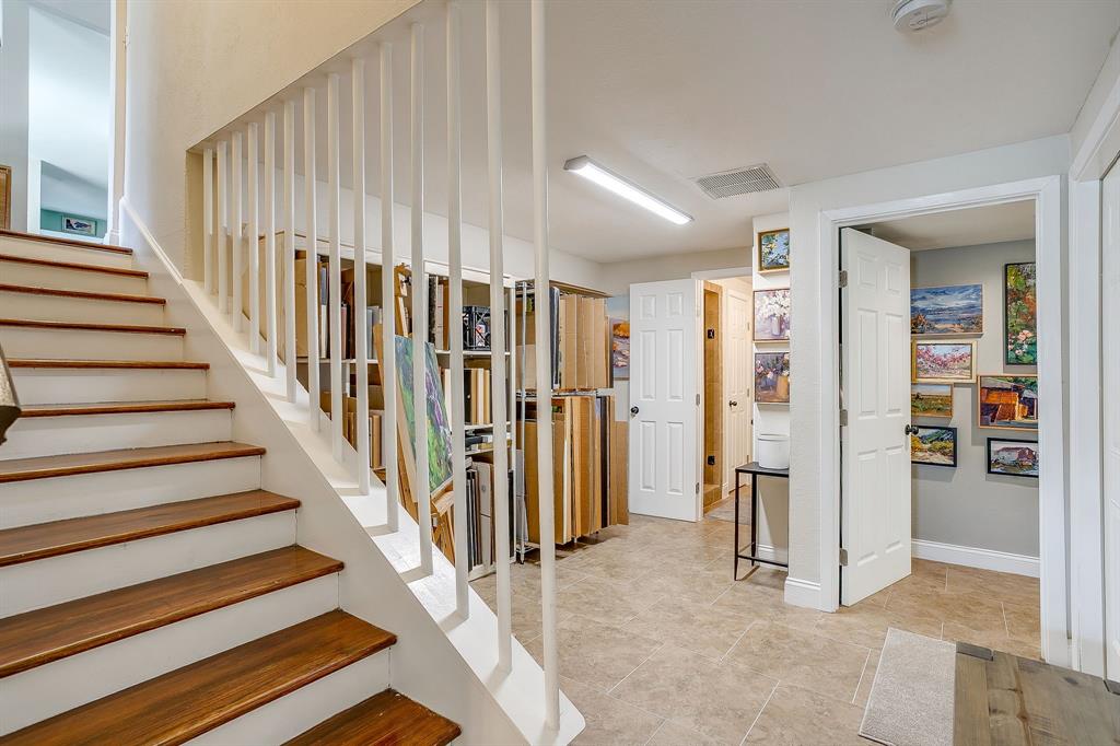 1816 Granada Road Fort Worth, TX 76116 - Photo 29 of 40 a view of entryway with wooden floor and stairs